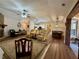 Spacious living room featuring hardwood floors, neutral tones, and a view of the kitchen at 112 Countryside Ct, Woodstock, GA 30189