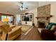 Cozy living room with stone fireplace, built-ins, ceiling fan and wood flooring at 112 Countryside Ct, Woodstock, GA 30189
