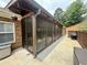 Screened-in patio area offering outdoor living space for relaxation and leisure at 112 Countryside Ct, Woodstock, GA 30189