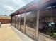 Spacious screened-in porch with outdoor views and space for entertainment at 112 Countryside Ct, Woodstock, GA 30189