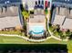 Aerial view showcases a pool with lounge chairs and putting green at 4020 Townsend Ln, Atlanta, GA 30346