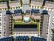Aerial view of a well-maintained residential community featuring a pool, putting green, and manicured green spaces at 4020 Townsend Ln, Atlanta, GA 30346