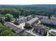 Aerial view showcasing a townhome community surrounded by lush greenery at 4020 Townsend Ln, Atlanta, GA 30346