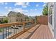 Balcony with wood decking and railing overlooking nearby neighborhood and parking at 4020 Townsend Ln, Atlanta, GA 30346