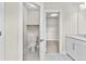 A bathroom featuring a toilet, shelves, sink, and closet at 4020 Townsend Ln, Atlanta, GA 30346
