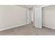Bedroom featuring carpet, a closet with double doors, and access to the hallway at 4020 Townsend Ln, Atlanta, GA 30346