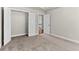 Bedroom featuring carpet and a closet with double doors for ample storage and organization at 4020 Townsend Ln, Atlanta, GA 30346