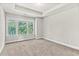 Bright bedroom with large windows and carpet, creating a comfortable living space at 4020 Townsend Ln, Atlanta, GA 30346