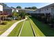 Community featuring a bocce ball court, green lawns, and well-maintained landscape at 4020 Townsend Ln, Atlanta, GA 30346