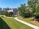 Community pool and putting green surrounded by lush lawn and attractive landscaping create an inviting outdoor space at 4020 Townsend Ln, Atlanta, GA 30346