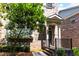 Charming brick townhome entrance with well-manicured landscaping at 4020 Townsend Ln, Atlanta, GA 30346