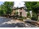 Brick townhome complex with manicured landscaping and street view at 4020 Townsend Ln, Atlanta, GA 30346