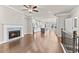 Open floorplan with fireplace, hardwood floors, and island kitchen at 4020 Townsend Ln, Atlanta, GA 30346