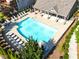Aerial view of a pool area featuring lounge chairs and manicured greenery at 4020 Townsend Ln, Atlanta, GA 30346