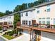 Townhome rear exteriors featuring spacious decks, garages, and well-maintained yards at 4020 Townsend Ln, Atlanta, GA 30346