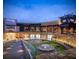 Upscale shopping center with a water feature, landscaped areas, restaurants and high-end retail stores at 4020 Townsend Ln, Atlanta, GA 30346