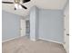 Bright bedroom with carpet flooring, ceiling fan, and white trim at 6625 Eagle Pt, Suwanee, GA 30024