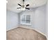 Bedroom with plush carpet, fan, and lots of natural light at 6625 Eagle Pt, Suwanee, GA 30024