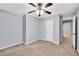 Inviting bedroom with carpet flooring, ceiling fan, and white trim at 6625 Eagle Pt, Suwanee, GA 30024