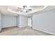 Spacious bedroom with neutral carpet and paint, featuring a ceiling fan at 6625 Eagle Pt, Suwanee, GA 30024