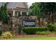 Attractive stone entrance and landscaping with the Fairgreen community name sign displayed at 6625 Eagle Pt, Suwanee, GA 30024