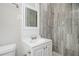 Modern bathroom featuring a vanity and a shower with gray tiled walls at 1305 Clay Sw Rd, Mableton, GA 30126