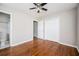 Bedroom featuring hardwood floors, a closet, and access to a full bathroom at 1305 Clay Sw Rd, Mableton, GA 30126