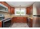 Modern kitchen with granite countertops, stainless steel appliances, and ample cabinet space at 1305 Clay Sw Rd, Mableton, GA 30126