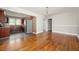 Spacious living room with beautiful hardwood floors and an open doorway to the kitchen at 1305 Clay Sw Rd, Mableton, GA 30126