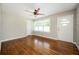 Inviting living room with hardwood floors, a large window, and a neutral color palette at 1305 Clay Sw Rd, Mableton, GA 30126