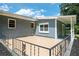 Back patio with tiled floor, black metal railing, and fenced-in yard at 1305 Clay Sw Rd, Mableton, GA 30126