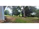 Spacious backyard featuring a well-maintained lawn, mature trees, and great sunlight at 2703 Hillvale Cove Dr, Lithonia, GA 30058