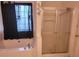 Bathroom with a jetted tub, glass enclosed shower, and a window for natural light at 2703 Hillvale Cove Dr, Lithonia, GA 30058