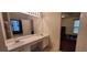 Bathroom featuring a dual sink vanity and a separate tub at 2703 Hillvale Cove Dr, Lithonia, GA 30058