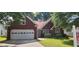 Charming single-story brick home with a well-maintained lawn, driveway and garage at 2703 Hillvale Cove Dr, Lithonia, GA 30058