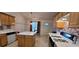 Well-lit kitchen with matching cabinets and an island for food prep at 2703 Hillvale Cove Dr, Lithonia, GA 30058