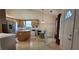 Bright kitchen featuring an island, stainless steel refrigerator, eat-in dining area, and updated backsplash at 2703 Hillvale Cove Dr, Lithonia, GA 30058