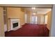 Cozy living room with a fireplace and plenty of light at 2703 Hillvale Cove Dr, Lithonia, GA 30058
