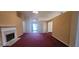 Open living room with great light and a marble fireplace at 2703 Hillvale Cove Dr, Lithonia, GA 30058