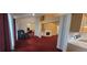 Open living area with a fireplace and view to kitchen at 2703 Hillvale Cove Dr, Lithonia, GA 30058