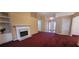 Living room showcasing a fireplace and built-in shelving at 2703 Hillvale Cove Dr, Lithonia, GA 30058