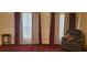 Sitting room with a chair, stool, and curtains at 2703 Hillvale Cove Dr, Lithonia, GA 30058
