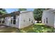 A well-maintained home exterior with good sized lawn and some bushes next to house at 2703 Hillvale Cove Dr, Lithonia, GA 30058