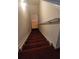 Carpeted staircase with neutral walls and a functional handrail leading to the upper level at 2703 Hillvale Cove Dr, Lithonia, GA 30058