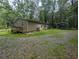 Lovely single-story home featuring a spacious backyard, carport, and a charming back porch at 512 S Holly Springs Rd, Woodstock, GA 30188