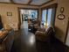 Open-concept living area with views of the kitchen and cozy armchairs at 512 S Holly Springs Rd, Woodstock, GA 30188