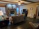 Spacious living room featuring a stone fireplace and wooden beamed ceilings at 512 S Holly Springs Rd, Woodstock, GA 30188