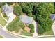 A house with an expansive driveway and meticulously kept lawn and landscaping at 1558 Amberwood Creek Nw Dr, Kennesaw, GA 30152
