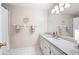 Bright bathroom with large mirror, granite counters, and shower with curtain at 1558 Amberwood Creek Nw Dr, Kennesaw, GA 30152