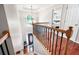 Bright foyer with hardwood floors, chandelier, stairway and view to the front door at 1558 Amberwood Creek Nw Dr, Kennesaw, GA 30152